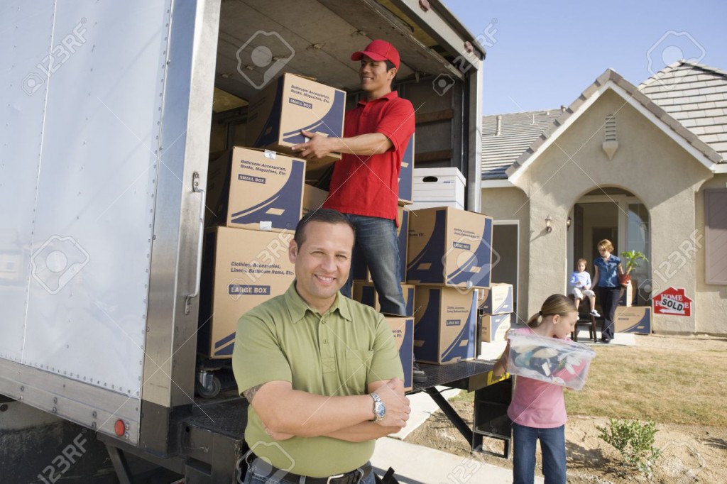 18833843-Family-and-worker-unloading-truck-of-cardboard-boxes-Stock-Photo